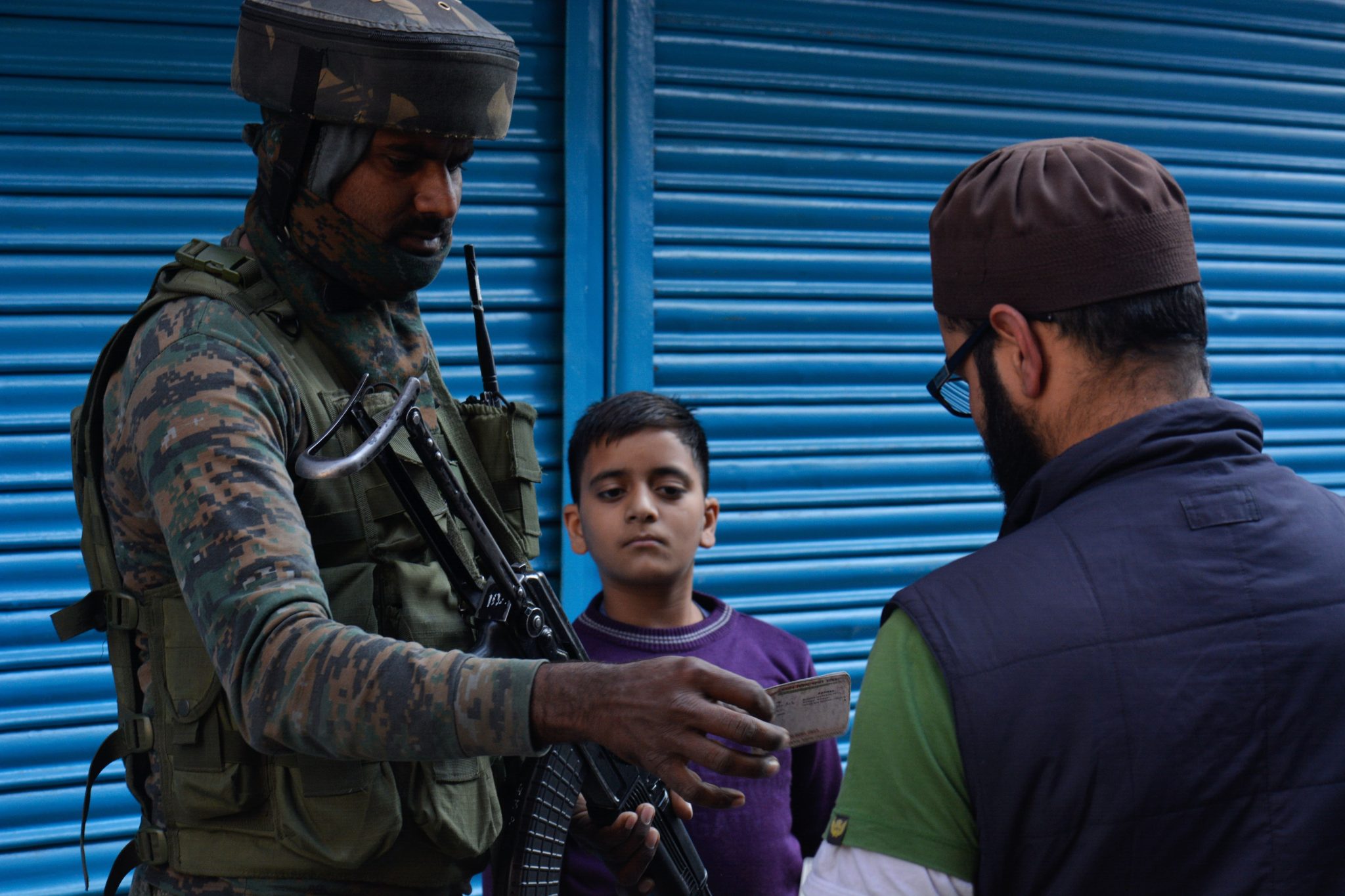 Nov. 4, 2019, Srinagar, Kashmir — An Indian army soldier checks the identity card
of a civilian during a cordon and search operation in Lalchowk, Srinagar.